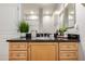 Bathroom featuring neutral walls, light wood cabinets, granite counters and stainless steel fixtures at 20660 N 40Th St # 2124, Phoenix, AZ 85050