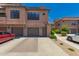 Beautiful townhome with a two-car garage, stone accents, and well-maintained landscaping at 20660 N 40Th St # 2124, Phoenix, AZ 85050