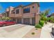 Stunning townhouse featuring a tile roof, attached garage, and lush landscape at 20660 N 40Th St # 2124, Phoenix, AZ 85050