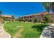 Beautifully landscaped exterior with lush green lawns, mature trees, and well-maintained building facades at 20660 N 40Th St # 2124, Phoenix, AZ 85050