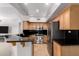 Stylish kitchen includes stainless steel appliances, granite counters, and modern cabinets at 20660 N 40Th St # 2124, Phoenix, AZ 85050