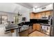 Modern kitchen boasts stainless steel appliances, granite countertops, and ample cabinet space at 20660 N 40Th St # 2124, Phoenix, AZ 85050