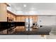 This modern kitchen features stainless steel appliances, granite countertops, and wood cabinets at 20660 N 40Th St # 2124, Phoenix, AZ 85050