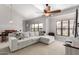 Inviting living room features high ceilings, a large window, and a comfortable sofa at 20660 N 40Th St # 2124, Phoenix, AZ 85050