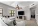 Bright living area features a cozy sofa, TV with fireplace, and a large window at 20660 N 40Th St # 2124, Phoenix, AZ 85050
