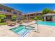Relaxing jacuzzi next to the community pool with lounge chairs and well-maintained landscaping at 20660 N 40Th St # 2124, Phoenix, AZ 85050