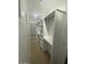 A clean white walk-in closet featuring well-designed shelving and ample storage space at 20660 N 40Th St # 2124, Phoenix, AZ 85050