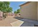 Large backyard with desert landscaping, a privacy wall, and a patio at 21833 N 34Th Ave, Phoenix, AZ 85027