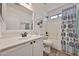 This bathroom showcases white cabinets, stylish fixtures, and a shower-tub combination at 21833 N 34Th Ave, Phoenix, AZ 85027