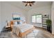 Bright bedroom with a cozy bed, white linens, wood accents, and stylish décor under a vaulted ceiling at 21833 N 34Th Ave, Phoenix, AZ 85027