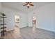 Spacious bedroom showcasing wood-look floors and doorway views to bathroom and kitchen at 21833 N 34Th Ave, Phoenix, AZ 85027