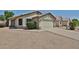 Charming single-story home featuring a two-car garage, low maintenance desert landscaping, and a neutral color palette at 21833 N 34Th Ave, Phoenix, AZ 85027