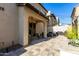 Picturesque backyard featuring a covered patio, comfortable seating, and a beautifully landscaped garden area at 2371 W Whisper Rock Trl, Phoenix, AZ 85085