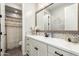 Bright bathroom with modern vanity, stylish mirror, mosaic backsplash, and an adjacent shower area at 2371 W Whisper Rock Trl, Phoenix, AZ 85085
