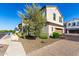 Charming two-story home with a well-maintained front yard, a two-car garage, and brick accents at 2371 W Whisper Rock Trl, Phoenix, AZ 85085