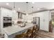 Modern kitchen with a large center island, stainless steel appliances, and ample cabinet space at 2371 W Whisper Rock Trl, Phoenix, AZ 85085