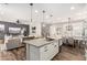 Open-concept kitchen with a large island, granite countertops, and stainless steel appliances at 2371 W Whisper Rock Trl, Phoenix, AZ 85085