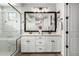 Bright main bathroom with a double vanity, large mirror, and modern fixtures at 2371 W Whisper Rock Trl, Phoenix, AZ 85085