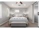 Serene main bedroom with soft lighting, neutral tones, and a decorative 'Mr. & Mrs.' pillow at 2371 W Whisper Rock Trl, Phoenix, AZ 85085