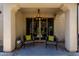 Charming outdoor patio area with comfortable seating, modern lighting, and a stylish geometric rug at 2371 W Whisper Rock Trl, Phoenix, AZ 85085