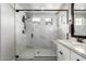 Spacious walk-in shower with marble-look tile, glass enclosure, and rainfall showerhead at 2371 W Whisper Rock Trl, Phoenix, AZ 85085