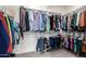 Spacious walk-in closet with ample hanging space and shelving for organized storage of clothes and accessories at 2371 W Whisper Rock Trl, Phoenix, AZ 85085