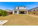 Spacious backyard featuring drought-tolerant landscaping and a stucco privacy wall at 24533 N 19Th Ter, Phoenix, AZ 85024