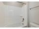 Bathroom featuring a standard shower-tub combo with white vinyl walls at 24533 N 19Th Ter, Phoenix, AZ 85024