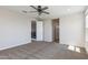 Bedroom with neutral carpet, ceiling fan, and entry to hallway at 24533 N 19Th Ter, Phoenix, AZ 85024