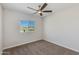 Bedroom featuring neutral walls, neutral carpet, and a window with neighborhood views at 24533 N 19Th Ter, Phoenix, AZ 85024
