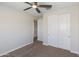 Bedroom featuring neutral walls, neutral carpet, closet, and a ceiling fan at 24533 N 19Th Ter, Phoenix, AZ 85024