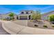 Inviting two-story home with a two-car garage and low-maintenance desert landscaping in front at 24533 N 19Th Ter, Phoenix, AZ 85024