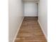 Hallway with light wood look tile and bright white walls at 24533 N 19Th Ter, Phoenix, AZ 85024
