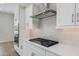 Bright kitchen features stainless steel appliances, gas range, white cabinets, and quartz countertops at 24533 N 19Th Ter, Phoenix, AZ 85024
