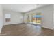 Spacious living room featuring tile floors, recessed lighting, and sliding glass doors to the backyard at 24533 N 19Th Ter, Phoenix, AZ 85024