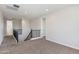 Upstairs loft area with carpet and natural light, offering flexible living space at 24533 N 19Th Ter, Phoenix, AZ 85024