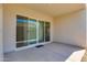 Contemporary patio with smooth flooring and large sliding glass doors, perfect for seamlessly blending indoor and outdoor living spaces at 24533 N 19Th Ter, Phoenix, AZ 85024