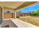 A covered patio with travertine tile offers an ideal outdoor living space at 24533 N 19Th Ter, Phoenix, AZ 85024