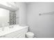 Bathroom with white vanity, framed mirror, shower/tub combo, and neutral wall color at 25 N Cottonwood St # 47, Chandler, AZ 85225