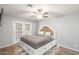 Comfortable bedroom with a ceiling fan, and a sliding glass door that brings in natural light at 25 N Cottonwood St # 47, Chandler, AZ 85225