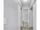 Bright hallway featuring modern wood-look flooring, closet space, and neutral paint at 25 N Cottonwood St # 47, Chandler, AZ 85225