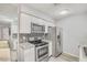Bright, updated kitchen with stainless steel appliances and granite counters, seamlessly designed at 25 N Cottonwood St # 47, Chandler, AZ 85225