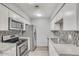 Well-lit kitchen featuring stainless steel appliances, granite countertops, and stylish backsplash at 25 N Cottonwood St # 47, Chandler, AZ 85225