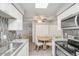 Bright kitchen with dining area features stainless appliances, granite counters, and a mirrored wall at 25 N Cottonwood St # 47, Chandler, AZ 85225
