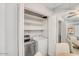 Convenient laundry room featuring modern washer and dryer units, plus added shelving for storage at 25 N Cottonwood St # 47, Chandler, AZ 85225
