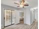 A living room features a sliding glass door entrance to a patio. A comfortable couch is in the background at 25 N Cottonwood St # 47, Chandler, AZ 85225