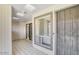 Enclosed sun room featuring a tiled floor, multiple windows, and access to the front and back of the home at 25 N Cottonwood St # 47, Chandler, AZ 85225