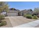 Charming single-story home with a three-car garage and a beautifully paved driveway, showcasing curb appeal at 2514 E Pleasant Ln, Phoenix, AZ 85042