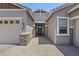 Inviting home exterior with a well-maintained facade, brick accents, and a beautifully paved walkway to the front door at 2514 E Pleasant Ln, Phoenix, AZ 85042
