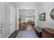 Open foyer featuring hardwood floors and a view of the inviting living space, enhancing a welcoming feel at 2514 E Pleasant Ln, Phoenix, AZ 85042